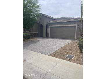 Charming single-story home with a well-maintained front yard and a two-car garage at 3211 W Pollack St, Phoenix, AZ 85041