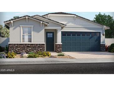 Charming single-story home featuring a two-car garage, stone accents, and low-maintenance landscaping at 5573 S 246Th Ave, Buckeye, AZ 85326