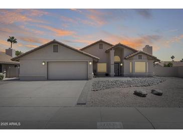 Charming single-story home featuring desert landscaping and a two-car garage at 7253 S Terrace Rd, Tempe, AZ 85283