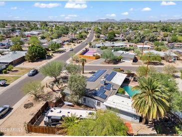An aerial view shows this home's lush surroundings and neighborhood at 1749 W Monterosa St, Phoenix, AZ 85015