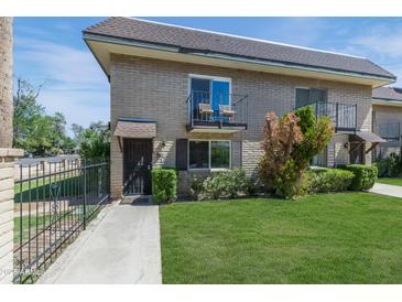 Charming condo featuring a private balcony, secure entry, and mature landscaping at 8135 N Central Ave # 1, Phoenix, AZ 85020