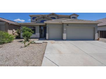 Charming home featuring a two-car garage, desert landscaping, and a tile roof on a sunny day at 18174 E Via Jardin --, Gold Canyon, AZ 85118