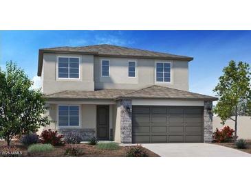 Charming two-story home featuring stone accents and a well-manicured front yard at 4920 W Walatowa St, Laveen, AZ 85339