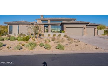 Stunning single-story home with desert landscaping, modern design, and inviting curb appeal at 8366 E Old Paint Trl # 3, Scottsdale, AZ 85266