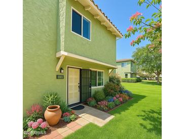 Charming two-story home with beautifully landscaped front yard and an inviting front entrance at 10215 N 8Th St # B, Phoenix, AZ 85020