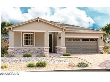Charming single-story home featuring a stone facade, neutral palette, and two-car garage at 21348 N Belt Dr, Maricopa, AZ 85138