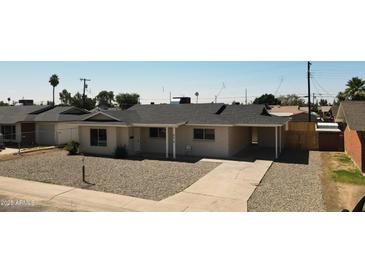 Charming single-story home with a well-maintained front yard and a covered parking area at 4219 W Citrus Way, Phoenix, AZ 85019