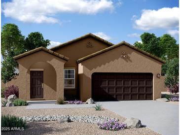 Charming one-story home with a two-car garage, desert landscaping and covered entry at 5840 W Coplen Farms Rd, Laveen, AZ 85339