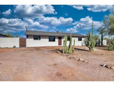 Charming single-story home featuring desert landscaping, a new roof, and a fresh exterior paint job at 639 N 102Nd Pl, Mesa, AZ 85207