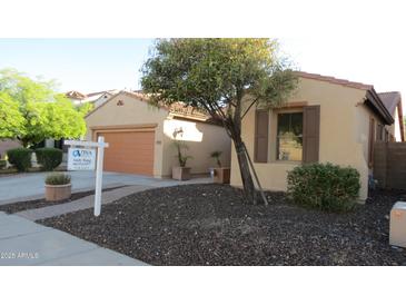 Charming single-story home featuring a well-manicured yard, inviting curb appeal, and a for sale sign at 29462 N 126Th Ln, Peoria, AZ 85383