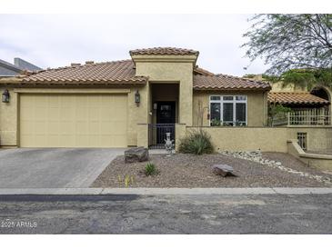 Charming single-story home featuring a tan exterior, tile roof, and a well-maintained front yard at 943 E Kortsen Rd # 2, Casa Grande, AZ 85122