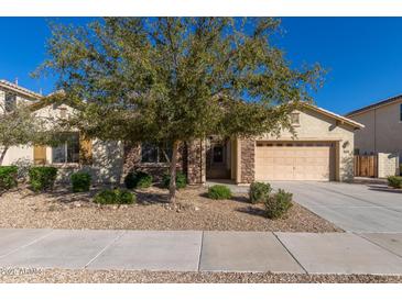 Charming single-Gathering home with desert landscaping, stone accents, and a two-car garage at 16758 W Apache St, Goodyear, AZ 85338