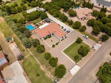 Aerial view featuring the home with a sparkling pool and RV parking at 18132 E Vencino St, Gilbert, AZ 85298