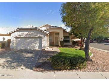 Charming single-story home featuring desert landscaping and a two-car garage at 351 S Apache Dr, Chandler, AZ 85224