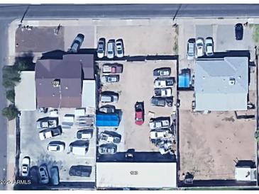 Aerial view of property showing buildings, parking and surrounding neighborhood at 1039 E Broadway Rd, Mesa, AZ 85204
