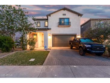 Charming two-story home showcasing a well-kept lawn and paved driveway with a black Toyota truck at 11541 E Corbin Ave, Mesa, AZ 85212