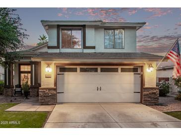 Charming two-story home featuring a two-car garage, landscaped yard, and inviting facade at 3466 E Bruce Ave, Gilbert, AZ 85234