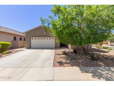 Charming single-story home featuring a two-car garage, desert landscaping, and a welcoming entrance at 3507 E Alfalfa Dr, Gilbert, AZ 85298