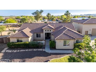 Charming single-story home with desert landscaping, and a tile roof, perfect for serene living at 3927 E Vista Grande --, San Tan Valley, AZ 85140
