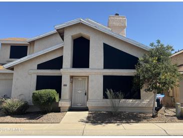 Charming front elevation of a two-story home with a well-manicured lawn and inviting entrance in a sunny neighborhood at 4210 W Rosemonte Dr, Glendale, AZ 85308