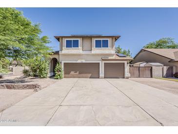 Two-story home with a spacious driveway and a two-car garage at 656 W Devon Ct, Gilbert, AZ 85233