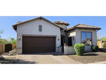 Charming single-story home featuring desert landscaping, a brick driveway, and a two-car garage at 1766 N Channing --, Mesa, AZ 85207