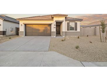 Beautiful single-story home with a two-car garage and low maintenance desert landscaping at 24066 W Cocopah St, Buckeye, AZ 85326