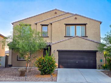 Charming two-story home with desert landscaping and a spacious two-car garage at 19954 W Moonlight Path, Buckeye, AZ 85326