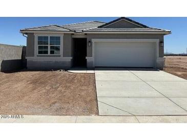 Charming single-story home featuring neutral tones, a two-car garage, and drought-tolerant landscaping at 38065 W Frascati Ave, Maricopa, AZ 85138