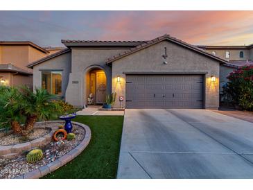 Charming single-story home with desert landscaping, and a two car garage at 11829 W Patrick Ln, Sun City, AZ 85373