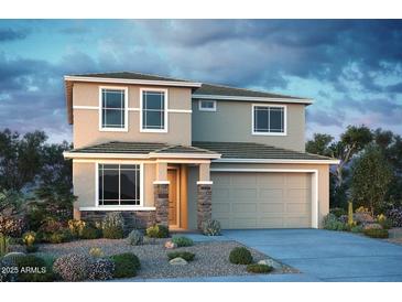 Charming two-story home with neutral colored stucco, decorative stonework, and a two-car garage at 12233 W Caraveo Pl, Peoria, AZ 85383