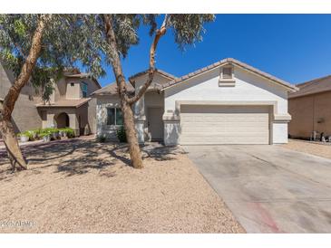 Charming single-story home featuring a two-car garage and low maintenance desert landscaping at 5635 S 11Th Dr, Phoenix, AZ 85041
