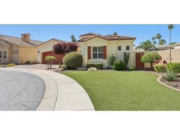 Charming home showcasing a well-manicured lawn and mature landscaping at 1535 W Winter Dr, Phoenix, AZ 85021