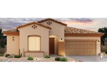 Charming single-story home with tile roof, neutral stucco and a well-manicured, desert-style front yard at 16343 W Morning Glory St, Goodyear, AZ 85338