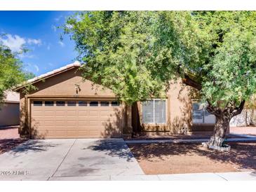 Charming single-Gathering home featuring a two-car garage and mature landscaping in a residential neighborhood at 2822 N 90Th Ave, Phoenix, AZ 85037