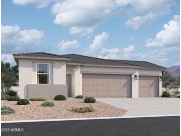 Beautiful single-story home features a three car garage, desert landscaping, and a neutral color palette at 46850 W Old Timer Rd, Maricopa, AZ 85139