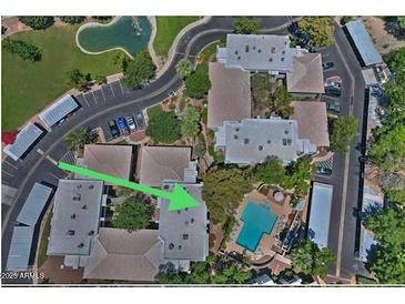 Aerial view of complex highlighting its pool and community amenities with plenty of parking at 5203 N 24Th St # 207, Phoenix, AZ 85016
