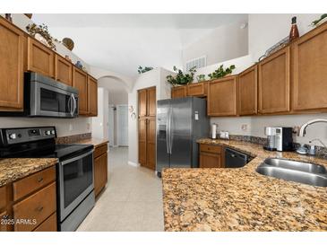 Spacious kitchen with stainless steel appliances, granite countertops, and ample cabinet space at 6080 S Jojoba Ct, Gold Canyon, AZ 85118