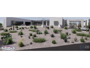 Modern exterior view showcasing desert landscaping and a contemporary design with a three-car garage at 9002 E Havasupai Dr, Scottsdale, AZ 85255