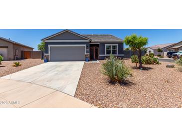 Charming single-story home featuring a two-car garage and low-maintenance desert landscaping at 30388 N Opal Dr, San Tan Valley, AZ 85143