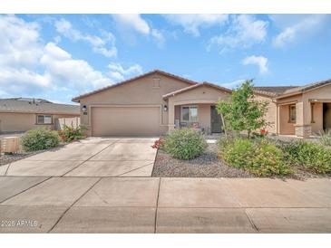 Charming single-story home with a well-maintained front yard and inviting entrance at 25787 W Allen St, Buckeye, AZ 85326