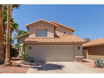 Two-story home showcasing a well-maintained front yard and an attached two-car garage at 3222 E Cortez St, Phoenix, AZ 85028