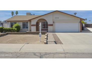 Charming single-story home showcasing a tidy front yard and inviting curb appeal at 3519 W Libby St, Glendale, AZ 85308