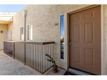 Inviting entryway with a stylish door and a well-maintained exterior at 7101 W Beardsley Rd # 542, Glendale, AZ 85308