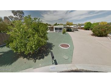 Well-maintained single-story home with mature trees and a mailbox at 8632 E Delilah Ave, Mesa, AZ 85208