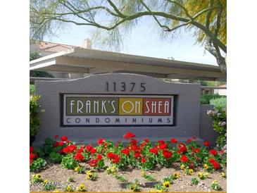 Sign for Frank's on Shea Condominiums with well maintained landscaping, and assigned covered parking in the background at 11375 E Sahuaro Dr # 1053, Scottsdale, AZ 85259