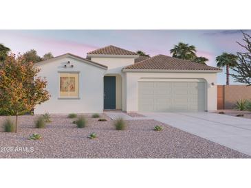 Charming single-story home featuring a neutral color palette, tile roof, and a low-maintenance gravel yard at 12633 W Luxton Ln, Avondale, AZ 85323
