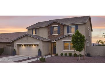 Charming two-story home featuring a two-car garage, landscaped yard, and inviting front entrance at 2854 E Virginia St, Mesa, AZ 85213