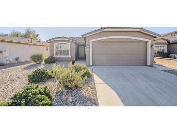 Charming single-story home with desert landscaping and a two-car garage at 3649 E Hazeltine Way, Chandler, AZ 85249