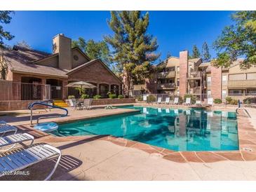 Resort-style pool with inviting lounge area at Chesapeake Condominiums, for relaxing and enjoying the outdoors at 200 E Southern Ave # 226, Tempe, AZ 85282